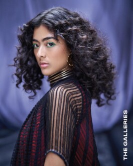 Close-up of Medhavi Chettri in striped mesh top and bold green eyeliner for The Galleries fashion campaign 