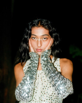 Indian model Akriti Jha wearing silver sequinned gloves and top for Contributor Magazine fashion editorial 