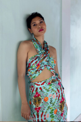 Merrylin Boro in a vibrant turquoise floral wrap set with leopard motifs by Verandah 