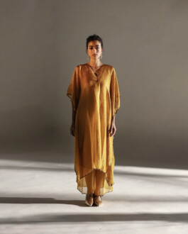 Medhavi Chettri wearing a mustard yellow silk kaftan set with palazzos for Mimamsaa campaign 