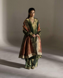 Medhavi Chettri wearing a regal green and rust traditional ensemble with embroidered dupatta, Mimamsaa campaign 