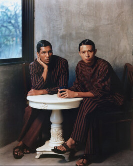 Gaurav Gharu, ALF model, seated in coordinated striped attire with co-model at a white table for Itoh campaign 