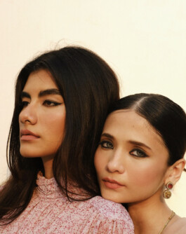 Anushree Vaze and another model pose in a soft, golden light wearing pink outfits for a Tira Beauty campaign 
