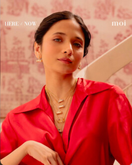 Anushree Vaze wearing layered gold necklaces and red blouse for Moi jewelry brand campaign 