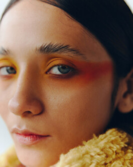 Close-up of Anushree Vaze with bold yellow and red eye makeup for Dirty Magazine 