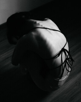 Artistic black and white photo of Tenzin Martha in an open-back outfit from an ALF editorial shoot 