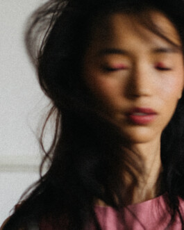 Dreamy close-up portrait of model Tenzin Martha with blurred motion and pink eyeshadow, photographed by Sameer Khatri for A Little Fly modeling agency 