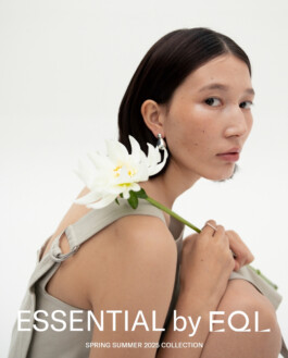 Ngawang Jinpa holding a white flower in a minimalist fashion campaign for Essential by EQL SS25 