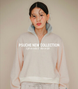 Ngawang Jinpa models a light beige zip-up sweatshirt for Psuche’s new collection with ALF India 