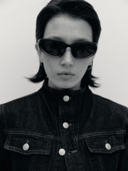 Ngawang Jinpa wearing sunglasses and denim jacket in a black-and-white editorial-style test shoot with Pai Models 
