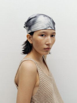 Ngawang Jinpa in a beige knit tank top and tie-dye headscarf, editorial fashion shoot with Pai Models 