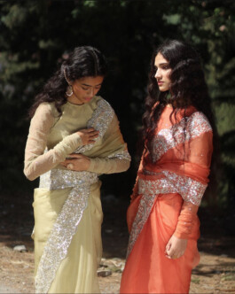 Medhavi Chettri and Deepika Sagar wearing sage green and coral embellished sarees for the Bruhi Pant Bhor campaign 