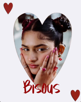 Close-up of model Aakriti Tyagi with space buns, heart-shaped rings, and pink nails for Norn’s Bisous campaign 