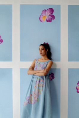 Akriti Jha poses in a soft blue floral midi dress with folded arms for Uri campaign 