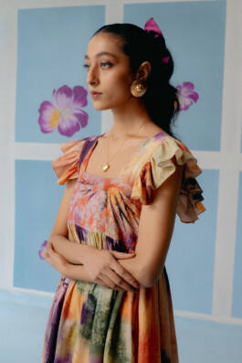 Model Akriti Jha poses in a multicoloured hand-painted ruffle dress for Uri clothing campaign 