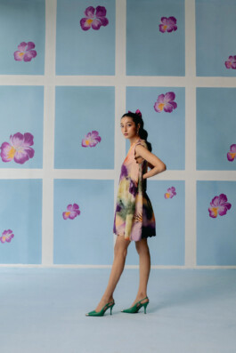 Model Akriti Jha poses in a multicolored mini dress for Uri’s floral-themed campaign 