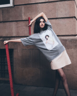 Yashvi Birla posing in a grey oversized T-shirt and beige mini skirt in an editorial photoshoot by photographer Om Ram for ALF modeling agency 