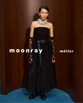 Ngawang Jinpa wearing a strapless black Moonray gown with intricate lacework and bold accessories for the Moonray Métiers campaign 