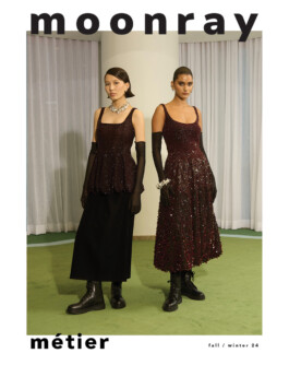 Ngawang Jinpa and co-model pose in embellished burgundy Moonray dresses with black boots and opera gloves for the Moonray Fall Winter 2024 campaign 