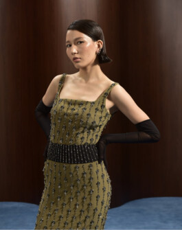 Ngawang Jinpa posing in an olive embellished dress and long black gloves for Moonray Métiers campaign, represented by ALF modeling agency India 