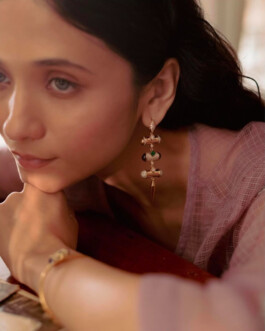 Close-up of Indian model Anushree Vaze wearing a statement earring and gold bracelet for Moi Jewellery campaign 
