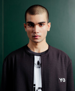 Close-up of model Prince in black Y-3 jacket and Adidas tee for Veg Non Veg India campaign 