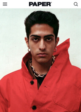Indian model Siddharth Raghavan in red jacket for Paper Magazine editorial 