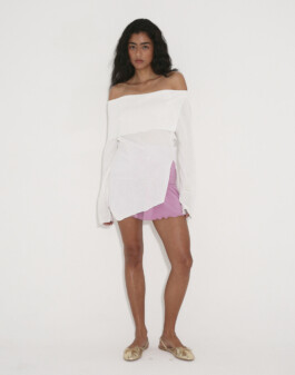 Medhavi Chettri models a white off-shoulder tunic with lilac shorts and gold flats for Polysoom. Represented by ALF modeling agency India 