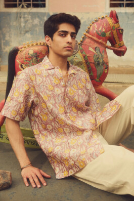 Model Siddharth Raghavan wearing floral printed shirt in traditional Indian setting for House of Tuti menswear campaign 