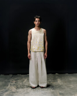 Siddharth Raghavan wearing a sleeveless sequined top and wide-leg linen pants for Puri fashion lookbook, represented by A Little Fly 