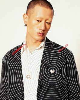 Sachit Gurung in a black-and-white concentric circle patterned suit with metallic accessories for Lovebirds Men Pre-Fall 2025 campaign by A Little Fly 