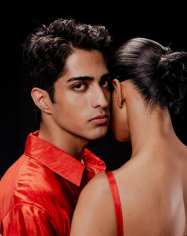 Siddharth Raghavan in a red silk shirt facing the camera, with another model turned away, for Puri fashion campaign by A Little Fly 