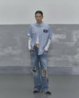Ngawang Jinpa in Alfred SS25 lookbook wearing striped short-sleeve shirt, ripped denim jeans, and layered white top, styled with Platinum Models Seoul for A Little Fly modeling agency India 