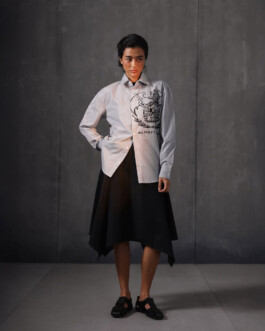 Medhavi Chettri, represented by ALF modeling agency, poses in a monochrome shirt with bold Almost Gods artwork and an asymmetrical black skirt for the brand’s campaign. 
