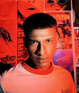 Albhei Ghazi, Indian male model represented by A Little Fly (ALF India), in an editorial shoot with bold red lighting and retro posters in the background 