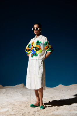 Model Akriti Jha in white shirt and skirt with bold multicolored sequin floral embroidery for Mohammed Mazhar campaign 