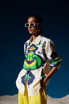 Model Akriti Jha in white sequined shirt with bold green and purple patterns styled with yellow trousers for Mohammed Mazhar campaign 