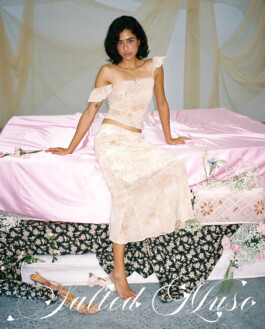 Medhavi Chettri sitting on a soft pink bed in a beige lace outfit for the Salted Muse campaign, feminine dreamy styling; represented by ALF India modeling agency. 